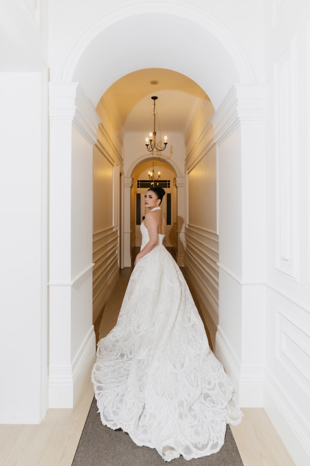 Bride in an arched hallway