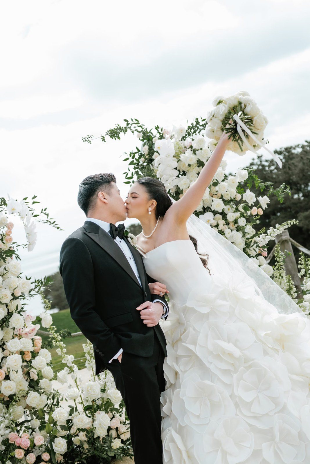 Couple with floral arch